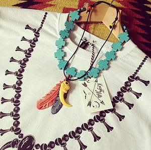 Squash blossom' tee styled with hand made necklaces.