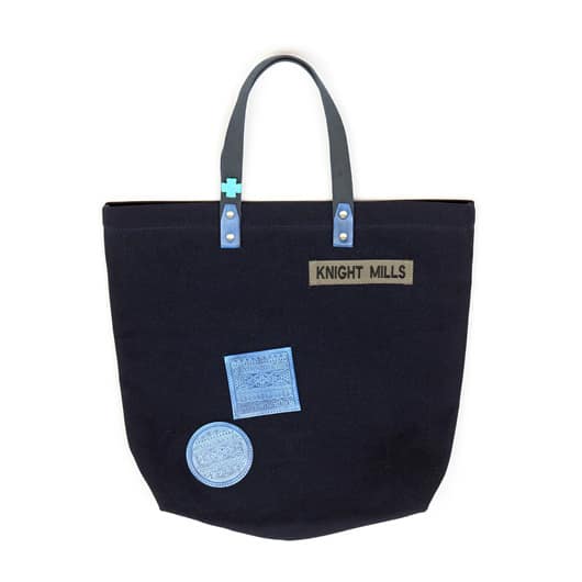 Indigo embossed leather patch detail tote, with buffalo stone cross detail and military spec Knight Mills name tape